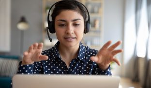 Businesswoman using a headset to speak on the phone
