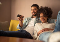 picture of man and woman watching TV