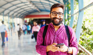 Bearded,Indian,Man,On,Metro,Station,Using,App,In,His